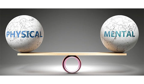 Two eggs on a balance, one labeled "physical" and the other "mental", symbolizing the delicate equilibrium between body and mind.